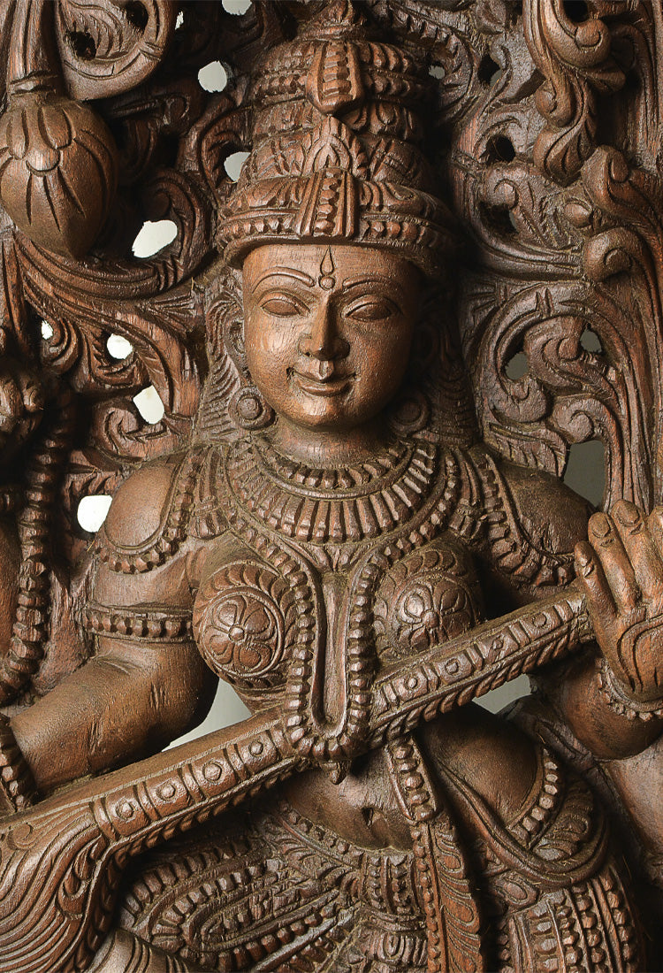 saraswati wood statue