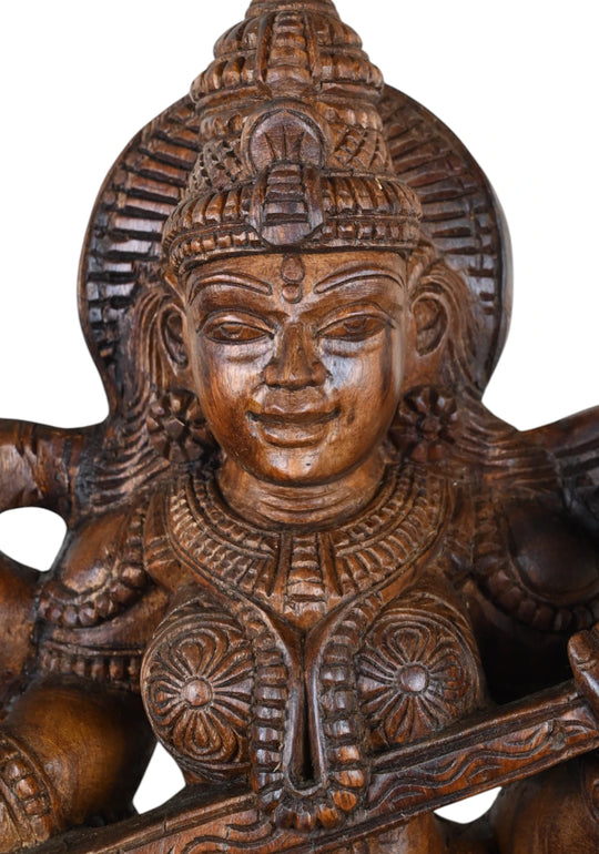 Saraswati playing the Veena with four arms 24"