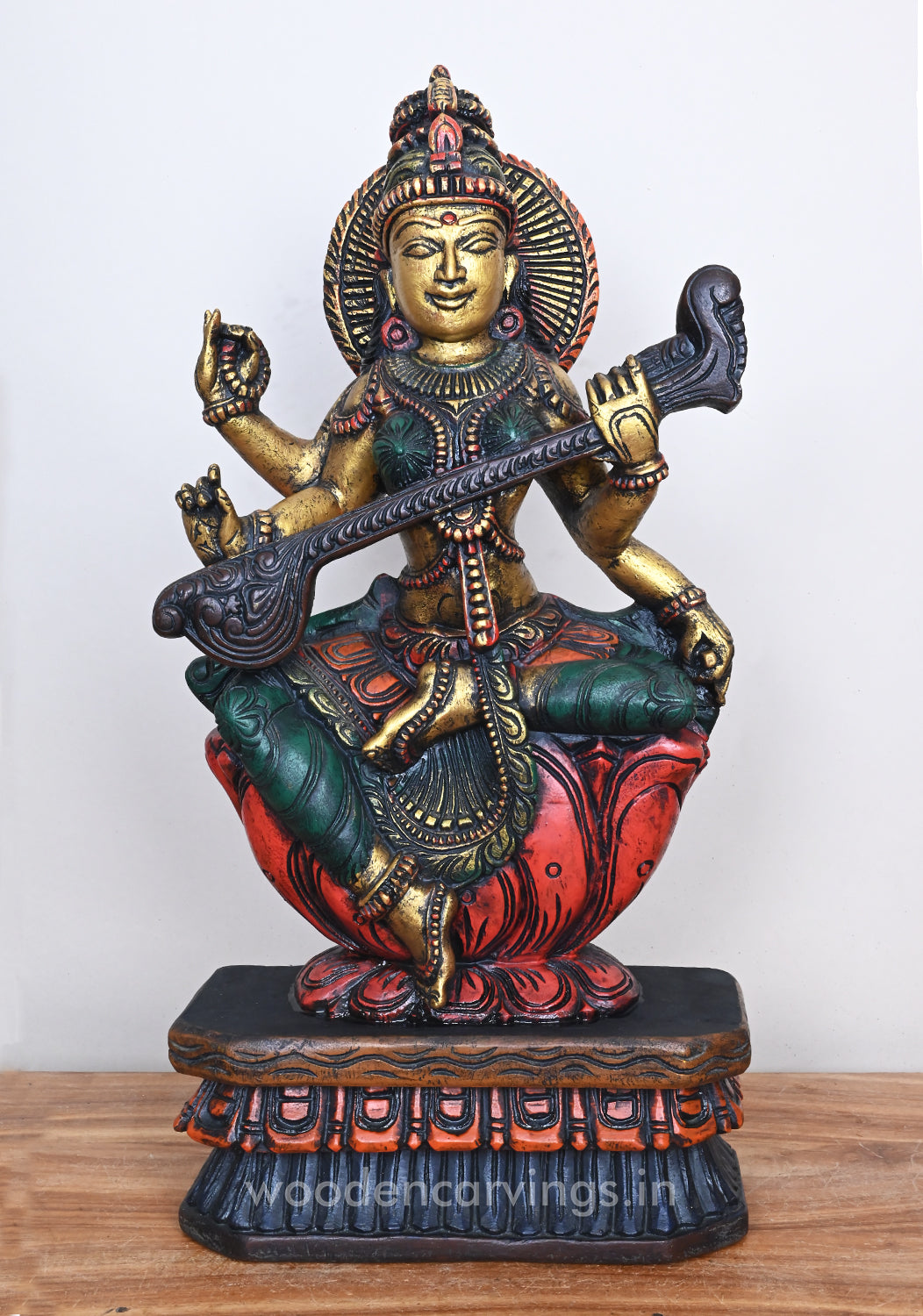 Smiling Goddess Saraswathi Seated On Red Lotus Beautiful Wooden Sculpt