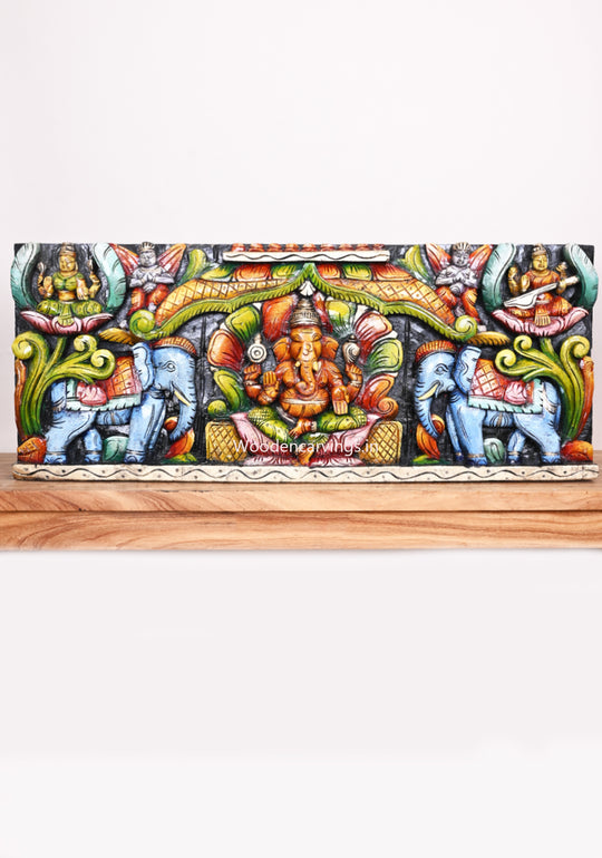 Wooden Petal Design Decorative Ganesh, Lakshmi, Saraswathi With Blue Elephants Multicoloured Wooden Wall Panel 36"