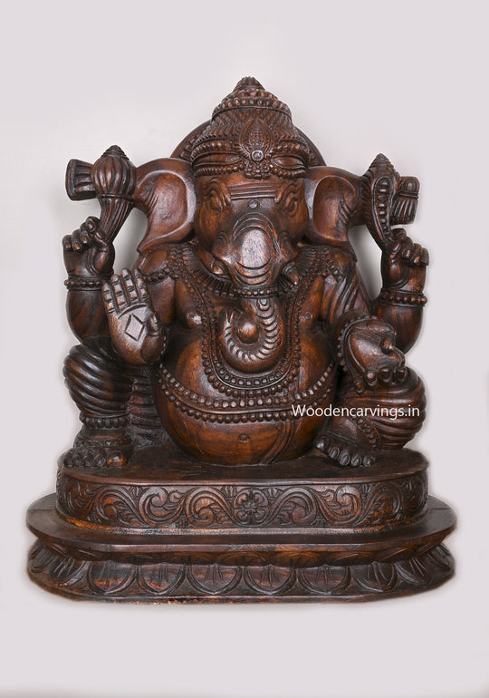 Shree Lambodara Lord Ganesh Seated on Base In Blessing Gesture Wooden Wax Brown Sculpture 27"