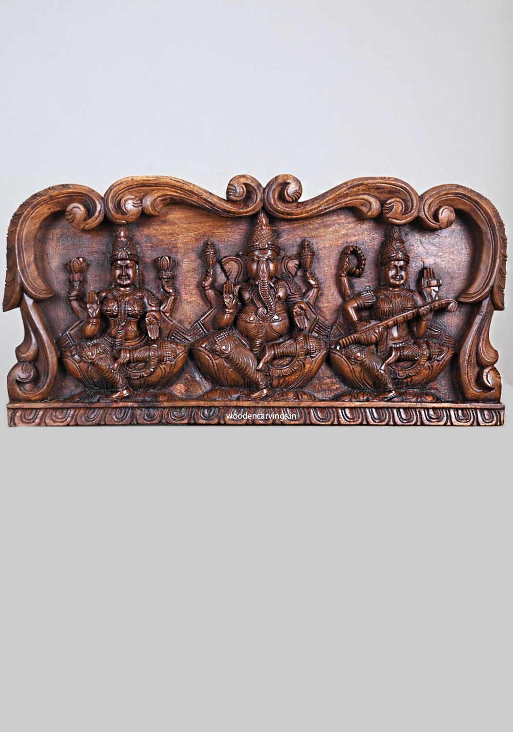 Floral Arch Wooden Ganesha Murti, Saraswati & Lakshmi Wall Panel 24"